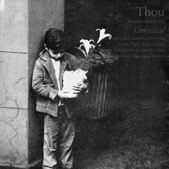 Black and white photo of a boy holding flowers standing against a wall, featuring Umbilical album art.