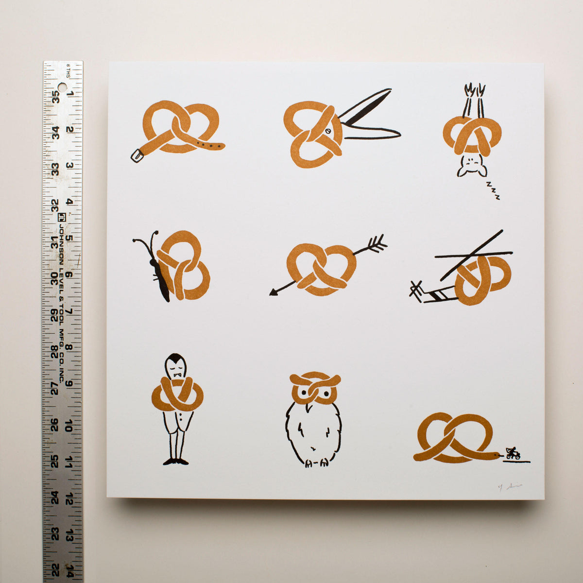 Tamara Shopsin Pretzel Print featuring nine creative pretzel designs with animals, objects, and characters on white background