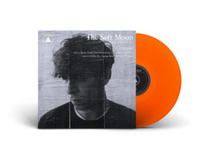 Criminal vinyl record with translucent orange disc and black-and-white cover featuring a man in shadow by The Soft Moon