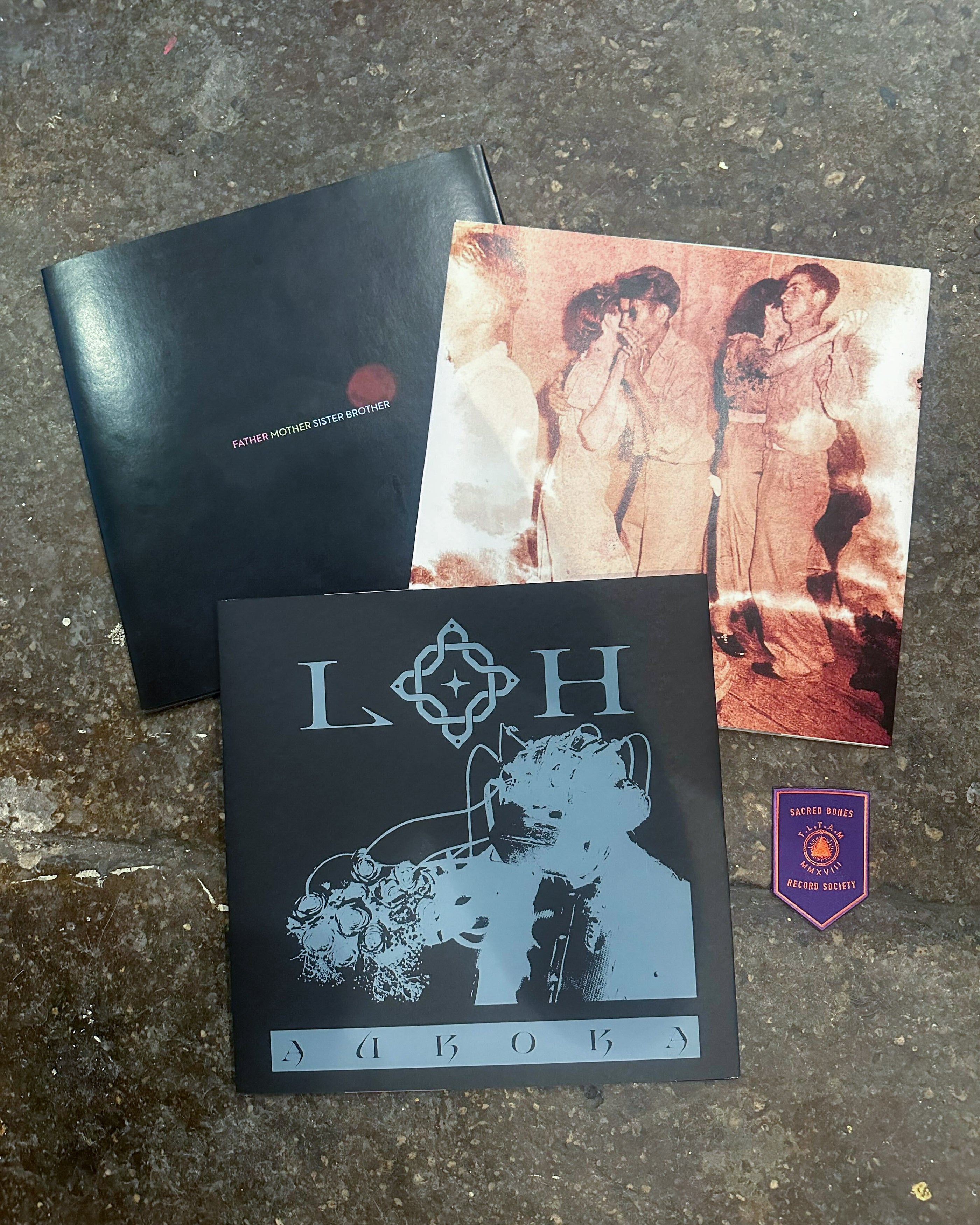 Records, merchandise, and a patch included in the Immigration Solidarity Record Raffle collection.