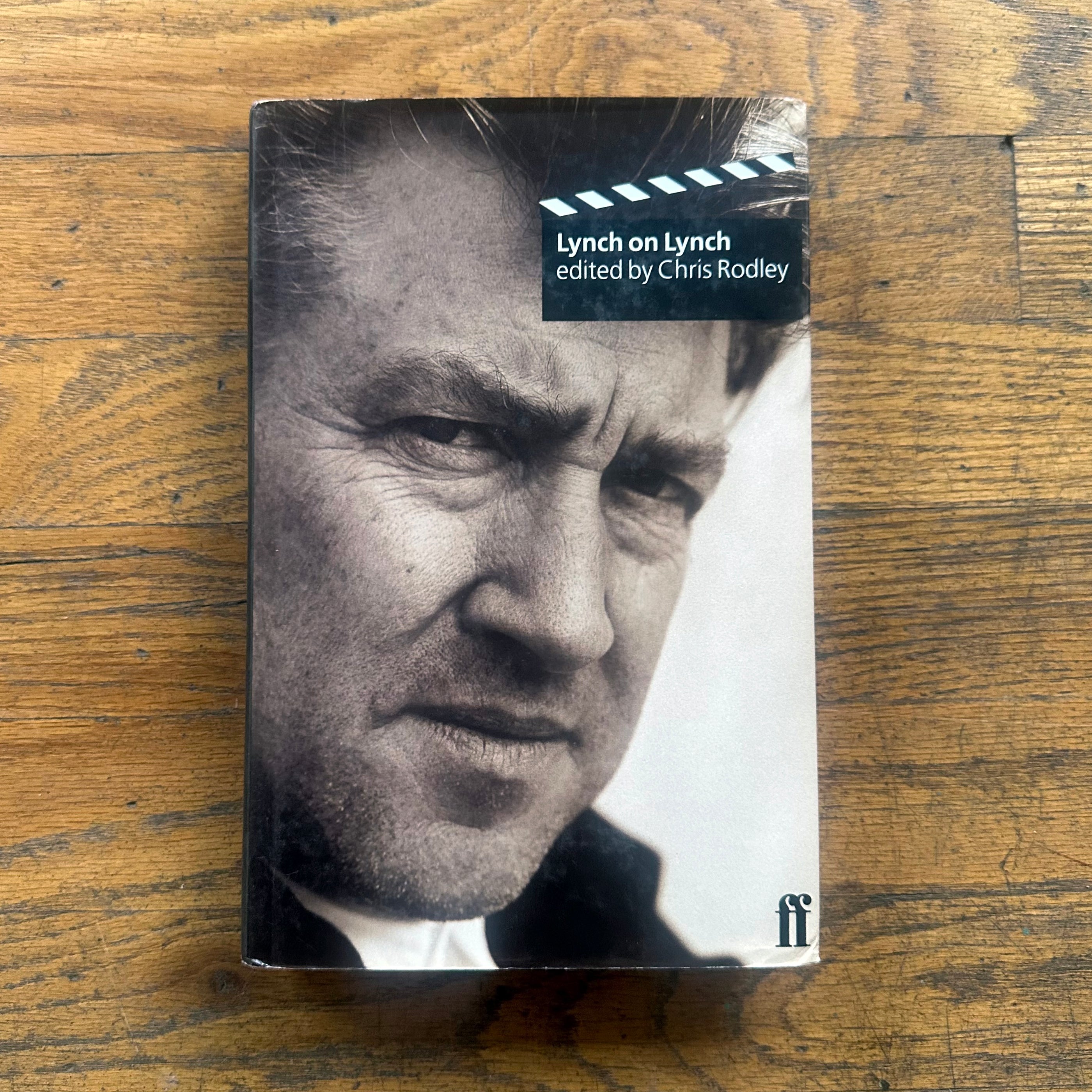 Lynch on Lynch book cover featuring a close-up black and white portrait of a man's face on wooden surface.