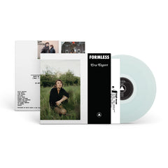 Clear vinyl record with album cover featuring a person sitting in tall grass, titled Formless